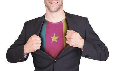 Image showing Businessman opening suit to reveal shirt with flag