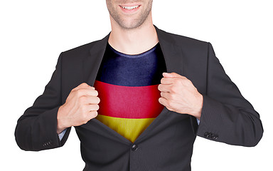 Image showing Businessman opening suit to reveal shirt with flag