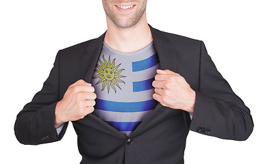 Image showing Businessman opening suit to reveal shirt with flag