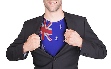 Image showing Businessman opening suit to reveal shirt with flag