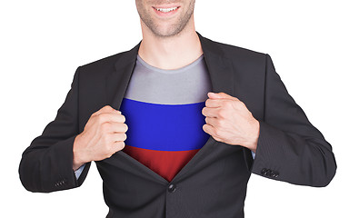 Image showing Businessman opening suit to reveal shirt with flag