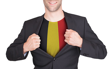 Image showing Businessman opening suit to reveal shirt with flag