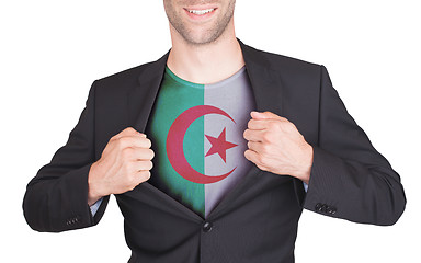 Image showing Businessman opening suit to reveal shirt with flag