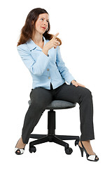 Image showing woman points at something sitting on an office chair