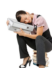 Image showing woman sleeping on the books. Tired office worker