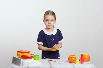 Image showing Girl with a plate cake in the kitchen