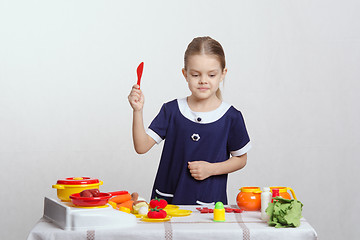 Image showing Girl chooses vegetable soup