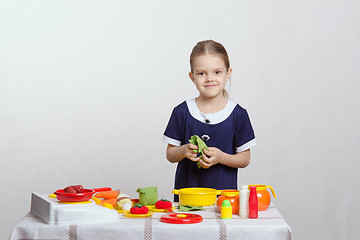 Image showing Girl five years preparing soup