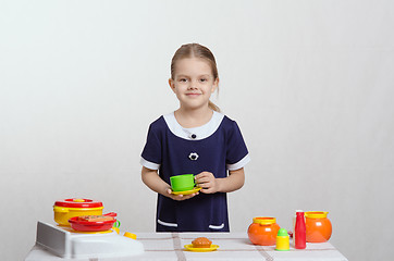 Image showing Girl playing toy dishes