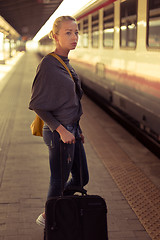 Image showing Lady waiting at the railway station.