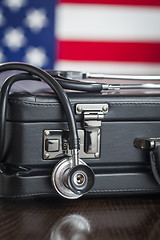 Image showing Briefcase and Stethoscope Resting on Table with American Flag Be