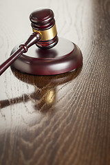 Image showing Wooden Gavel Abstract on Reflective Table