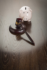 Image showing Gavel and Piggy Bank on Table