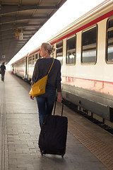 Image showing Lady waiting at the railway station.