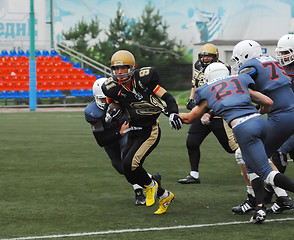 Image showing S. Nikiforov (91) run with ball