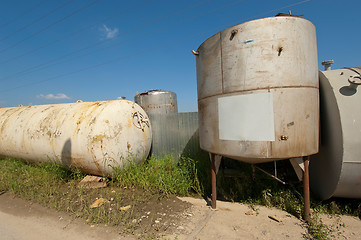 Image showing Few metal tank in row