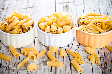 Image showing uncooked pasta in three bowls 