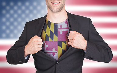 Image showing Businessman opening suit to reveal shirt with state flag