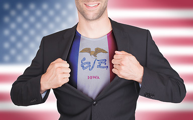 Image showing Businessman opening suit to reveal shirt with state flag