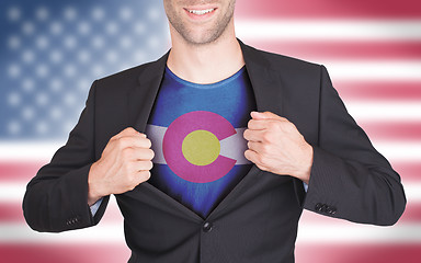 Image showing Businessman opening suit to reveal shirt with state flag
