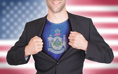 Image showing Businessman opening suit to reveal shirt with state flag