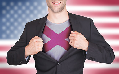 Image showing Businessman opening suit to reveal shirt with state flag