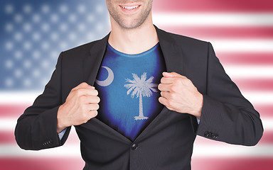 Image showing Businessman opening suit to reveal shirt with state flag