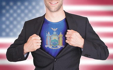 Image showing Businessman opening suit to reveal shirt with state flag