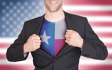 Image showing Businessman opening suit to reveal shirt with state flag