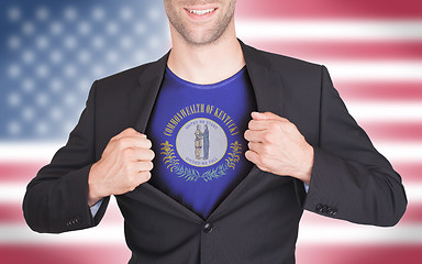 Image showing Businessman opening suit to reveal shirt with state flag