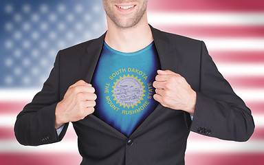 Image showing Businessman opening suit to reveal shirt with state flag