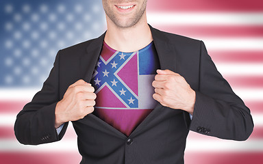 Image showing Businessman opening suit to reveal shirt with state flag