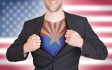 Image showing Businessman opening suit to reveal shirt with state flag