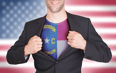 Image showing Businessman opening suit to reveal shirt with state flag