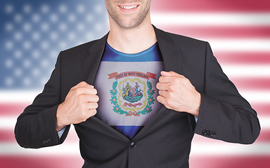 Image showing Businessman opening suit to reveal shirt with state flag