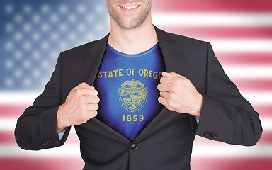 Image showing Businessman opening suit to reveal shirt with state flag