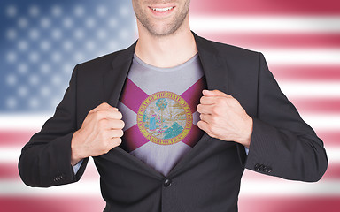 Image showing Businessman opening suit to reveal shirt with state flag