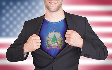 Image showing Businessman opening suit to reveal shirt with state flag