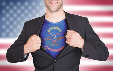 Image showing Businessman opening suit to reveal shirt with state flag