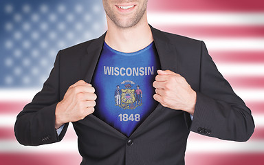 Image showing Businessman opening suit to reveal shirt with state flag