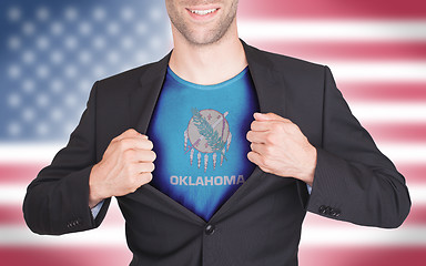 Image showing Businessman opening suit to reveal shirt with state flag