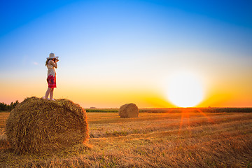 Image showing Beautiful Young Girl Woman In Dress Staying On Haystack