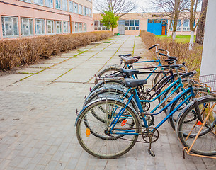 Image showing Five Old Bikes Leaning On The Street