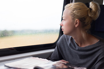 Image showing Lady traveling by train.