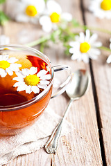 Image showing cup of tea with chamomile flowers 