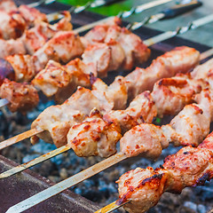 Image showing Shish Kebab In Process Of Cooking On Open Fire Outdoors