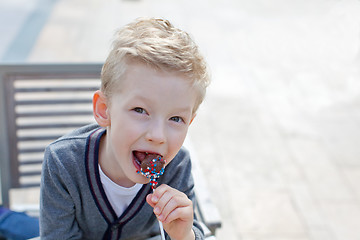 Image showing boy with candy