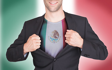 Image showing Businessman opening suit to reveal shirt with flag