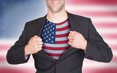 Image showing Businessman opening suit to reveal shirt with flag