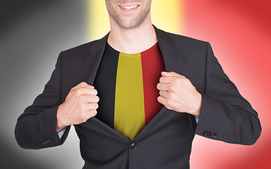 Image showing Businessman opening suit to reveal shirt with flag